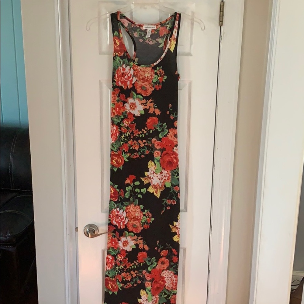 Black maxi dress with floral pattern.